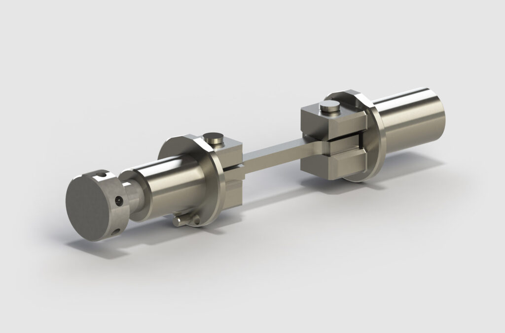 Eine Nahaufnahme eines metallischen mechanischen Bauteils mit zwei zylindrischen Enden, die durch eine zentrale Stange verbunden sind. Es scheint sich um ein präzisionsgefertigtes Teil zu handeln, möglicherweise Teil einer größeren Maschine oder mechanischen Baugruppe. Der Hintergrund ist schlicht und hell und zeigt die Qualität, die durch die Materialprüfung mit innovativer Mikroskopie von Kammrath & Weiss gewährleistet wird.